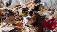 A resident looks through the piles of debris, insulation, and home furnishings to see if anything is salvageable at a tornado demolished mobile home park in Rolling Fork, Miss. March 25, 2023. Emergency officials in Mississippi say several people have been killed by tornadoes that tore through the state on Friday night, destroying buildings and knocking out power as severe weather produced hail the size of golf balls moved through several southern states. (AP Photo/Rogelio V. Solis)