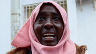 A Sudanese refugee cries during a protest in the Tunisian capital