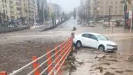 A car is seen next to the underpass that got flooded following torrential rains, in Sanliurfa, Turkey March 15, 2023, in this screen grab obtained from a social media video. Esat Baran/via REUTERS THIS IMAGE HAS BEEN SUPPLIED BY A THIRD PARTY. MANDATORY CREDIT. NO RESALES. NO ARCHIVES.