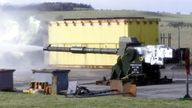 A depleted uranium shell is fired from a Challenger 2 barrel in a training area in Scotland 