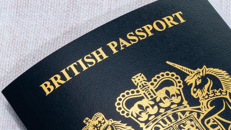 New style blue British passport. - Image ID: 2H8E58N (RM)
