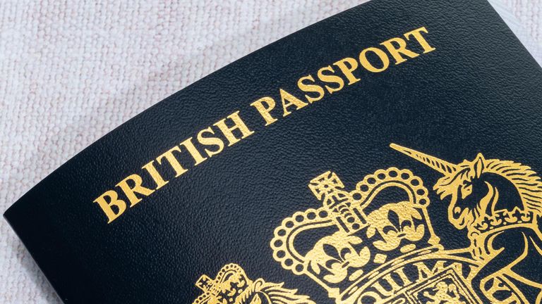 New style blue British passport. - Image ID: 2H8E58N (RM)
