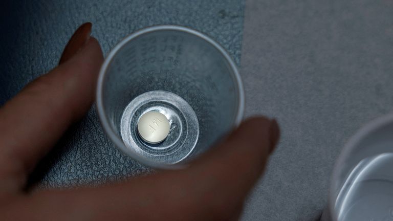 FILE PHOTO: A patient prepares to take mifepristone, the first pill given in a medical abortion, at Women&#39;s Reproductive Clinic of New Mexico in Santa Teresa, U.S., January 13, 2023. REUTERS/Evelyn Hockstein/File Photo/File Photo