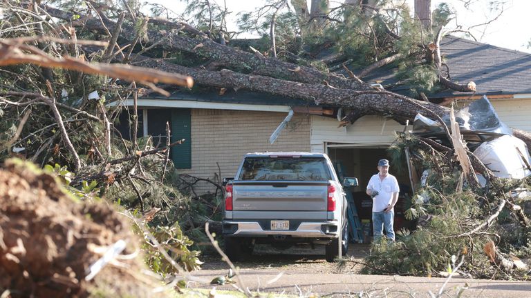 A homeowner surveys damage in Amory, Mississippi.Photo: Associated Press