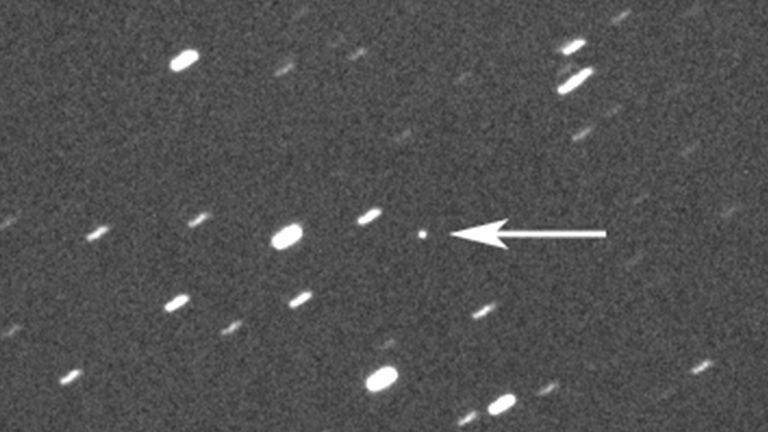 This photo provided by Gianluca Masi shows asteroid 2023 DZ2, indicated by arrow at center, about 1.8 million kilometers (1.1 million miles) away from the Earth on March 22, 2023. On Saturday, March 25, 2023, the asteroid, big enough to wipe out a city, will harmlessly zip between Earth and the moon. While asteroid flybys are common, NASA said it...s rare for one so big to come so close _ about once a decade. Scientists estimate its size somewhere between 140 feet and 310 feet. (42 meters and 94 meters). (Gianluca Masi/Virtual Telescope Project via AP)