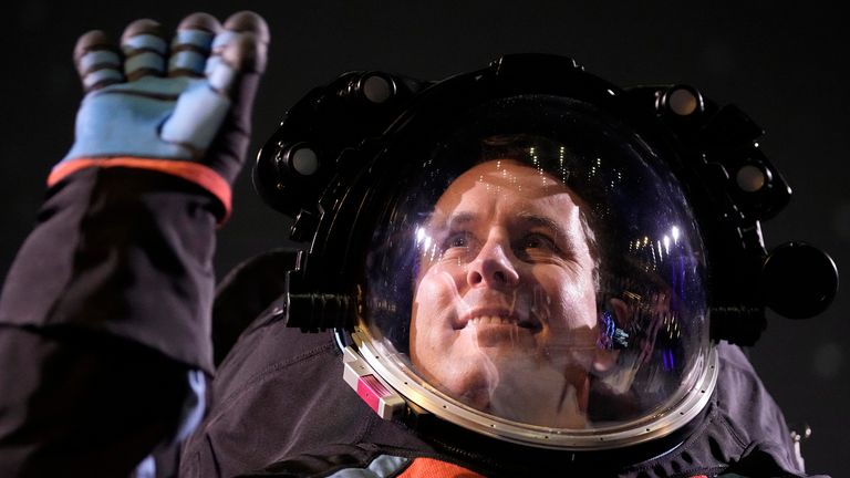 Axiom Space Chief Engineer Jim Stein demonstrates a prototype spacesuit.  Photo: AP