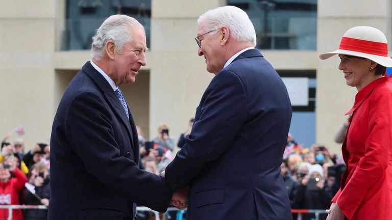 German President Frank-Walter Steinmeier shakes hands with Britain's King Charles