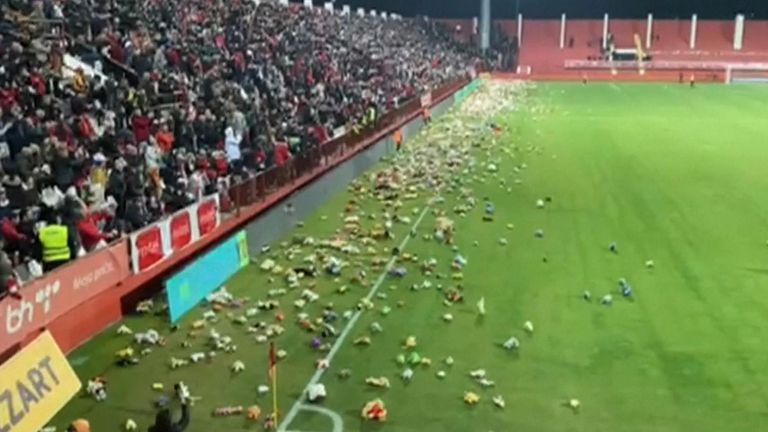 Bosnian football fans throw toys onto the pitch for children affected by the earthquake in Turkey and Syria