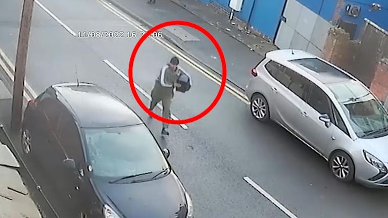 Burglar runs down street with safe