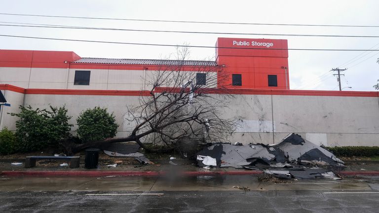 A fallen tree and debris are seen after a tornado damaged several buildings in Montebello