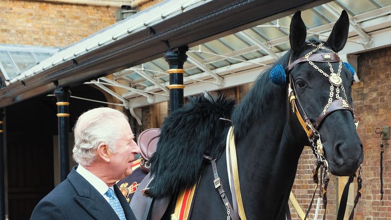 MANDATORY CREDIT: Buckingham Palace. Undated handout photo issued by Buckingham Palace of King Charles III meeting Noble, the horse gifted to him by the Royal Canadian Mounted Police, at The Royal Mews in Windsor. Issue date: Saturday March 11, 2023.