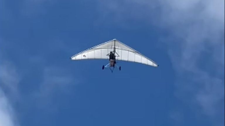 Cuban migrants fly into Key West airport on motorised hang glider
