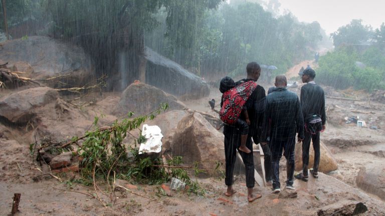 People look at the damage caused by Cyclone Freddy in Chilobwe, Blantyre, Malawi, March 13, 2023. REUTERS/Eldson Chagara.