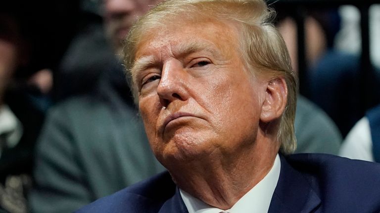 FILE - Former President Donald J. Trump watches the NCAA Wrestling Championships, Saturday, March 18, 2023, in Tulsa, Okla. (AP Photo/Sue Ogrocki, File)