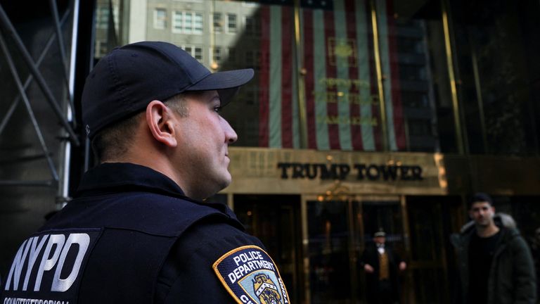 A police officer stands outside Trump Tower, days after a message was posted on the Truth Social account of former U.S. President Donald Trump stating that he had expected to be arrested, and called on his supporters to protest, in New York City, U.S. March 22, 2023. REUTERS/David &#39;Dee&#39; Delgado