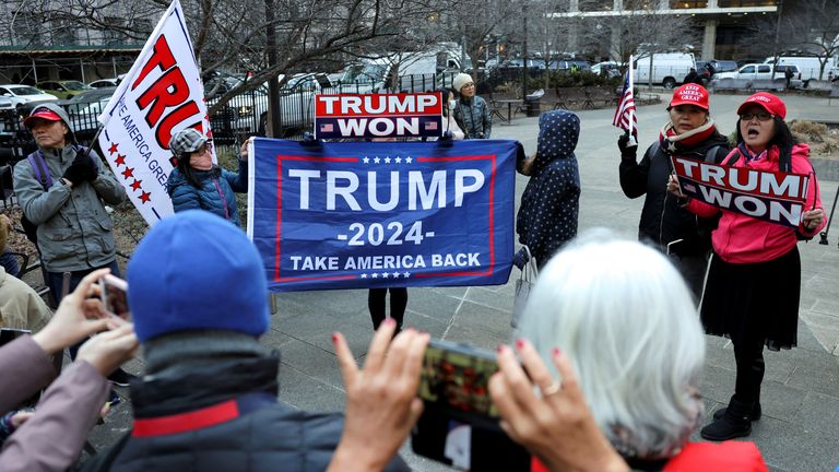 Supporters of Donald Trump protest outside the New York court where district attorney Alvin Bragg continues his investigation