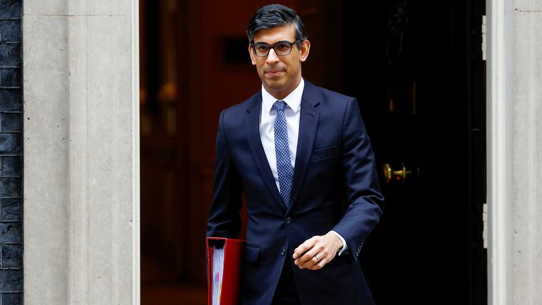 Rishi Sunak walks in Downing Street 