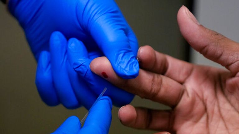 Patient gets finger-prick test. Pic: AP