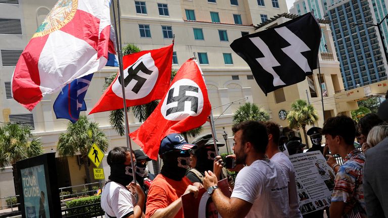 Nazi swastika wavers argue with conservatives during a protest outside the Tampa Convention Center, the site of Turn Point USA's Student Action Summit (SAS) (TPUSA), in Tampa, Florida, USA July 23, 2022. REUTERS /Marco Bello