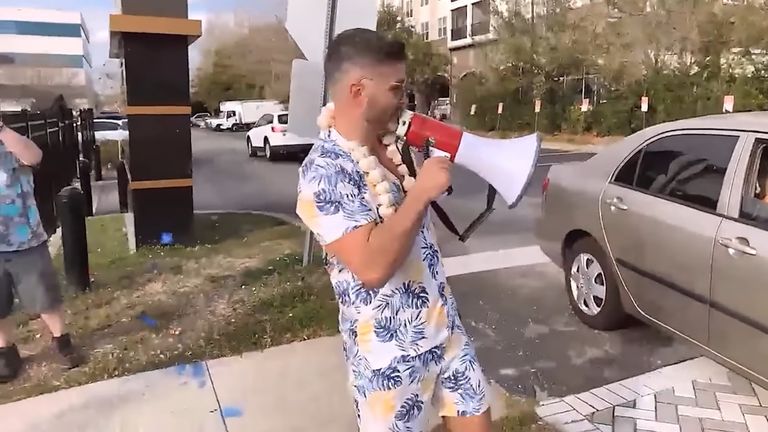 A member of a far-right group harasses Jews outside a synagogue.  NEO-NAZIS FEATURES ONLY UNLESS REMOVED