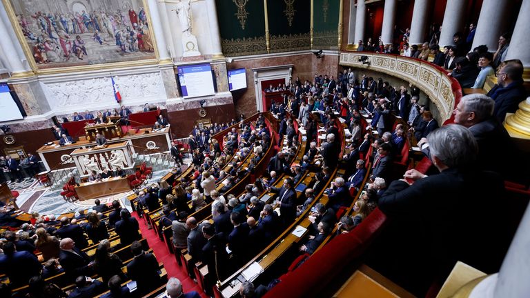 French Prime Minister Elisabeth Borne, left, delivers a speech at the National Assembly in Paris. Pic: AP