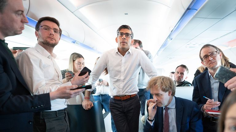 Prime minister Rishi Sunak answers questions from the press on his plane to San Diego