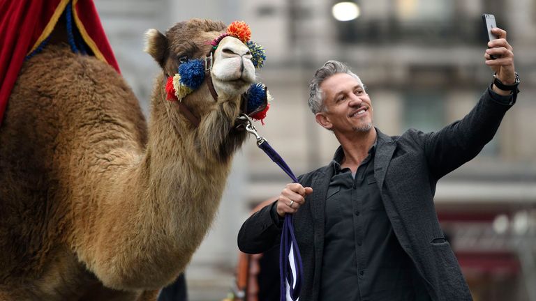 Gary Lineker takes a selfie with a camel as he brings Thailand, Morocco, India and New York to Marble Arch, London, for the launch of Walkers Spell & Go campaign, where people collect letters in packs of crisps to be in with a chance of winning one of 20,000 holidays up for grabs. PRESS ASSOCIATION Photo. Picture date: Friday April 15, 2016. Photo credit should read: Lauren Hurley/PA Wire