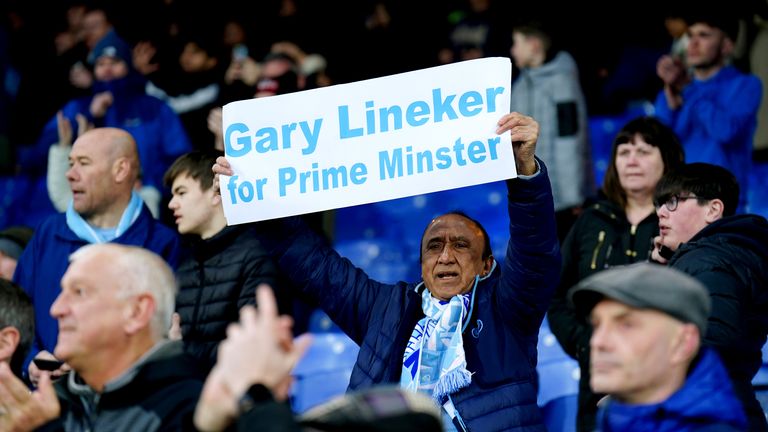 A Manchester City fan holds up a sign in support of Match of the Day presenter Gary Lineker ahead of the Premier League match at Selhurst Park, London. Picture date: Saturday March 11, 2023.