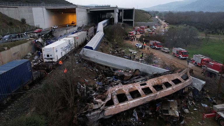 Rescue crews operate at the site of a crash, where two trains collided, near the city of Larissa, Greece