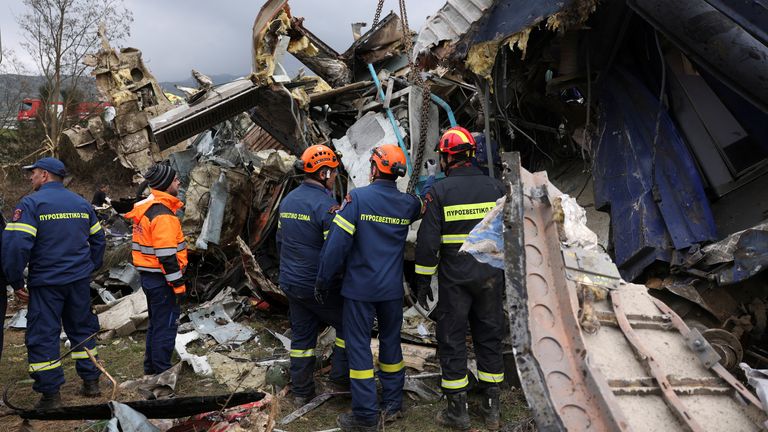 Rescuers operate at the site of a crash