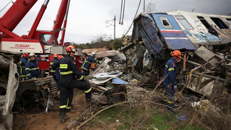 Rescuers operate at the site of an accident, where two trains collided, near the town of Larissa, Greece, March 1, 2023. REUTERS/Alexandros Avramidis