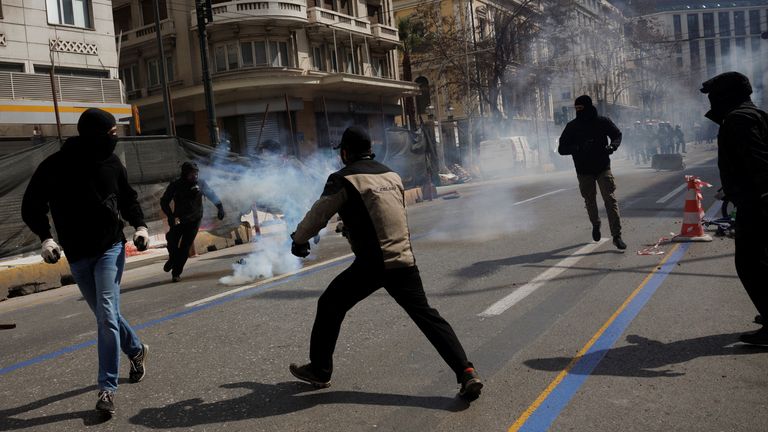 Protesters clash with riot police as clashes take place during a demonstration following the collision of two trains, near the city of Larissa, in Athens, Greece, March 5, 2023. REUTERS/Alkis Konstantinidis