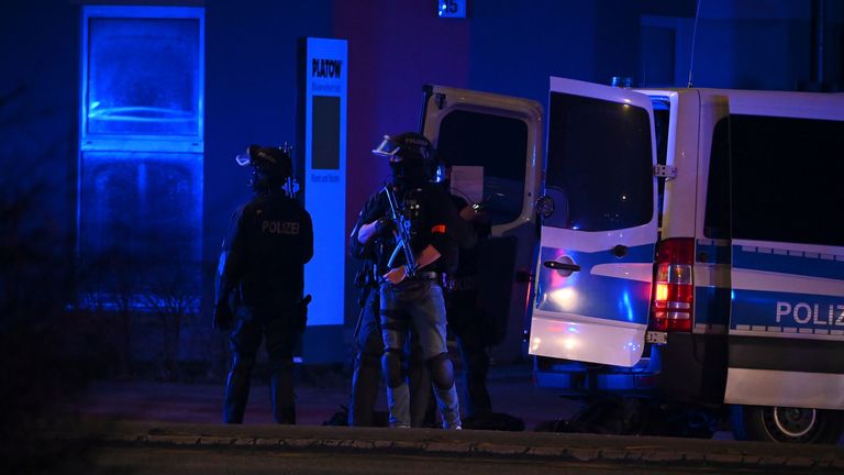 Armed police officers near the scene in Hamburg. Pic: AP