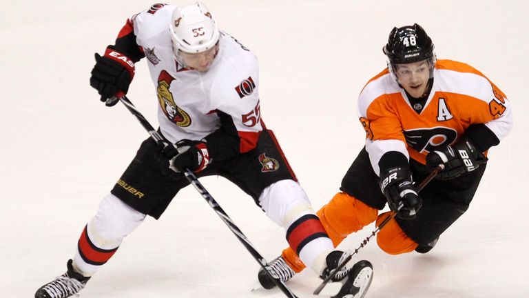 Philadelphia Flyers center Danny Briere (48) steals the puck from Ottawa Senators defenseman Sergei Gonchar (55) during the first period of their NHL ice hockey game in Philadelphia, Pennsylvania January 7, 2012. REUTERS/Tim Shaffer (STATE UNITED - Tag : SPORT ICE HOCKEY)