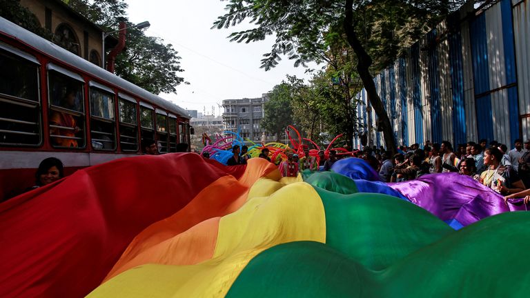 FILE PHOTO: Participants hold a rainbow flag during gay pride parade, which is promoting gay, lesbian, bisexual and transgender rights, in Mumbai, January 31, 2015. REUTERS/Danish Siddiqui/File Photo
