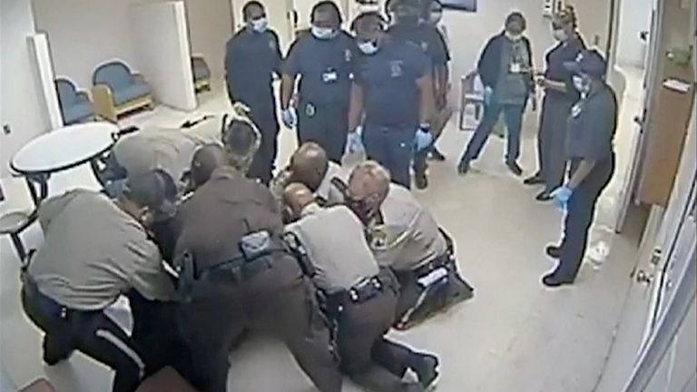 Virginia sheriff deputies wrestle with Irvo Otieno, a 28-year-old Black man, at a state mental hospital before he died, in a still image from video surveillance at Central State Hospital in Petersburg, Virginia, U.S. March 6, 2023. Dinwiddie County Commonwealth Attorney&#39;s Office/Handout via REUTERS THIS IMAGE HAS BEEN SUPPLIED BY A THIRD PARTY.