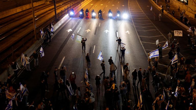 People block a road during a demonstration as Israeli Prime Minister Benjamin Netanyahu&#39;s nationalist coalition government presses on with its contentious judicial overhaul, in Tel Aviv, Israel March 4, 2023. REUTERS/Amir Cohen