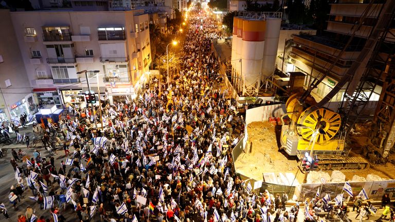 People attend a demonstration, as Israeli Prime Minister Benjamin Netanyahu's nationalist coalition government presses on with its judicial overhaul, in Tel Aviv, Israel 