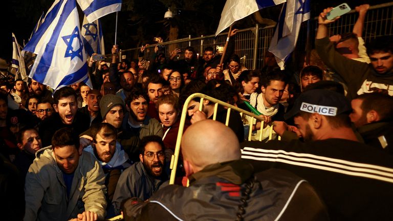 People attend a demonstration after Israeli Prime Minister Benjamin Netanyahu dismissed the defense minister and his nationalist coalition government presses on with its judicial overhaul, in Jerusalem, March 26, 2023. REUTERS/Ronen Zvulun