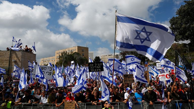 People attend a demonstration after Israeli Prime Minister Benjamin Netanyahu dismissed the defense minister as his nationalist coalition government presses on with its judicial overhaul, in Jerusalem, March 27, 2023. REUTERS/Ammar Awad
