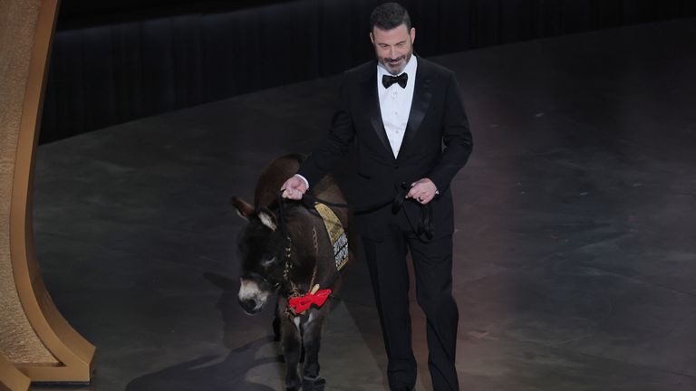 Host Jimmy Kimmel brings out a donkey during the Oscars show at the 95th Academy Awards in Hollywood, Los Angeles, California, U.S., March 12, 2023. REUTERS/Carlos Barria
