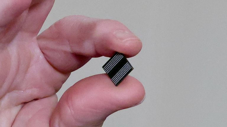 FILE PHOTO: U.S. President Joe Biden holds a semiconductor chip as he speaks prior to signing an executive order, aimed at addressing a global semiconductor chip shortage, in the State Dining Room at the White House in Washington, U.S., February 24, 2021. REUTERS/Jonathan Ernst/File Photo