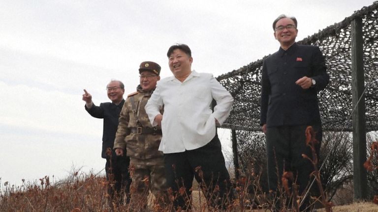 Kim Jong Un and senior officials watching drills