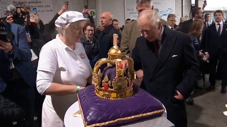 King Charles tries a crown cake
