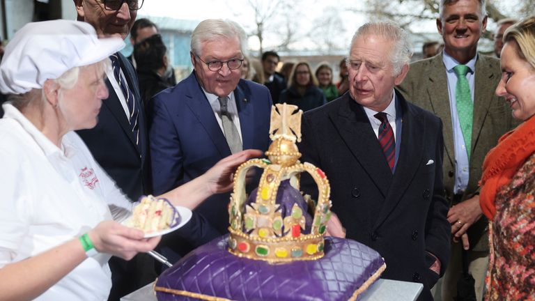 King Charles III looks at a cake made especially for his visit in the Brodowin eco-village
Pic:AP