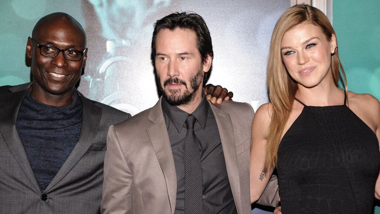 Lance Reddick, Keanu Reeves, and Adrianne Palicki arrive at the LA screening of John Wick in 2014