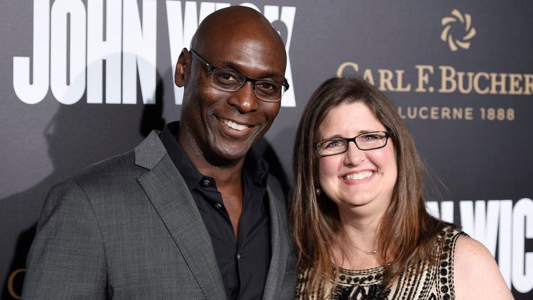 Lance Reddick poses with his wife Stephanie at the premiere of John Wick: Chapter 2 in 2017. Pic: Chris Pizzello/Invision/AP