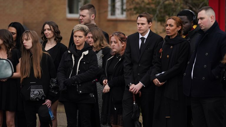 Mourners watch as the funeral cortege for murder victim Leah Croucher makes its way to Crownhill Crematorium in Milton Keynes for a private service. The 19-year-old&#39;s body was found in a loft at a house in Milton Keynes last October, three years after she disappeared. Picture date: Friday March 3, 2023.