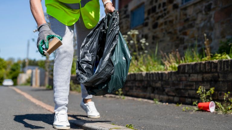 Litter Picking in her Community stock photo