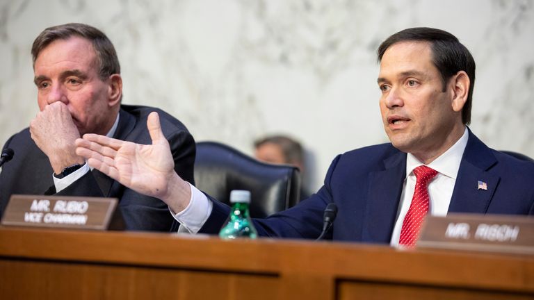 (L-R) Chairman Mark Warner listens as vice chairman Marco Rubio speaks during a Senate Intelligence Committee hearing. Pic: AP